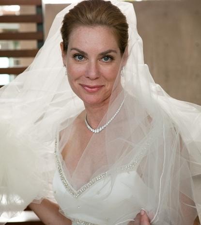 Toni Rigdon client — elegant bride with veil and pearl necklace, blue eyes, soft bridal makeup